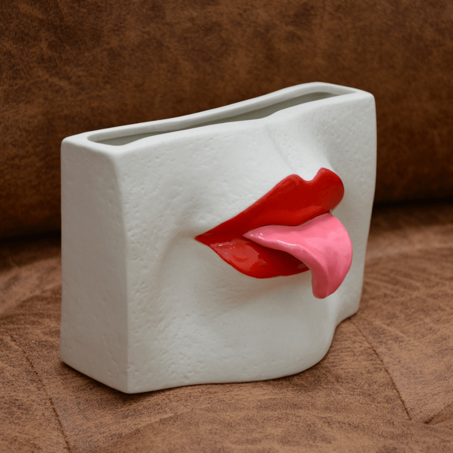 CERAMIC TONGUE-OUT VASE