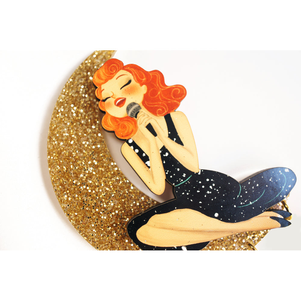 Singer sitting on the Moon Brooch by Laliblue Quirks!
