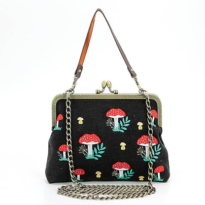 Mushrooms Kisslock Frame Handbag in Cotton: Black Quirks!