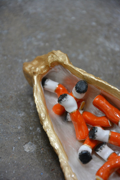 OYSTER SHELL CIGARETTE SCULPTURE
